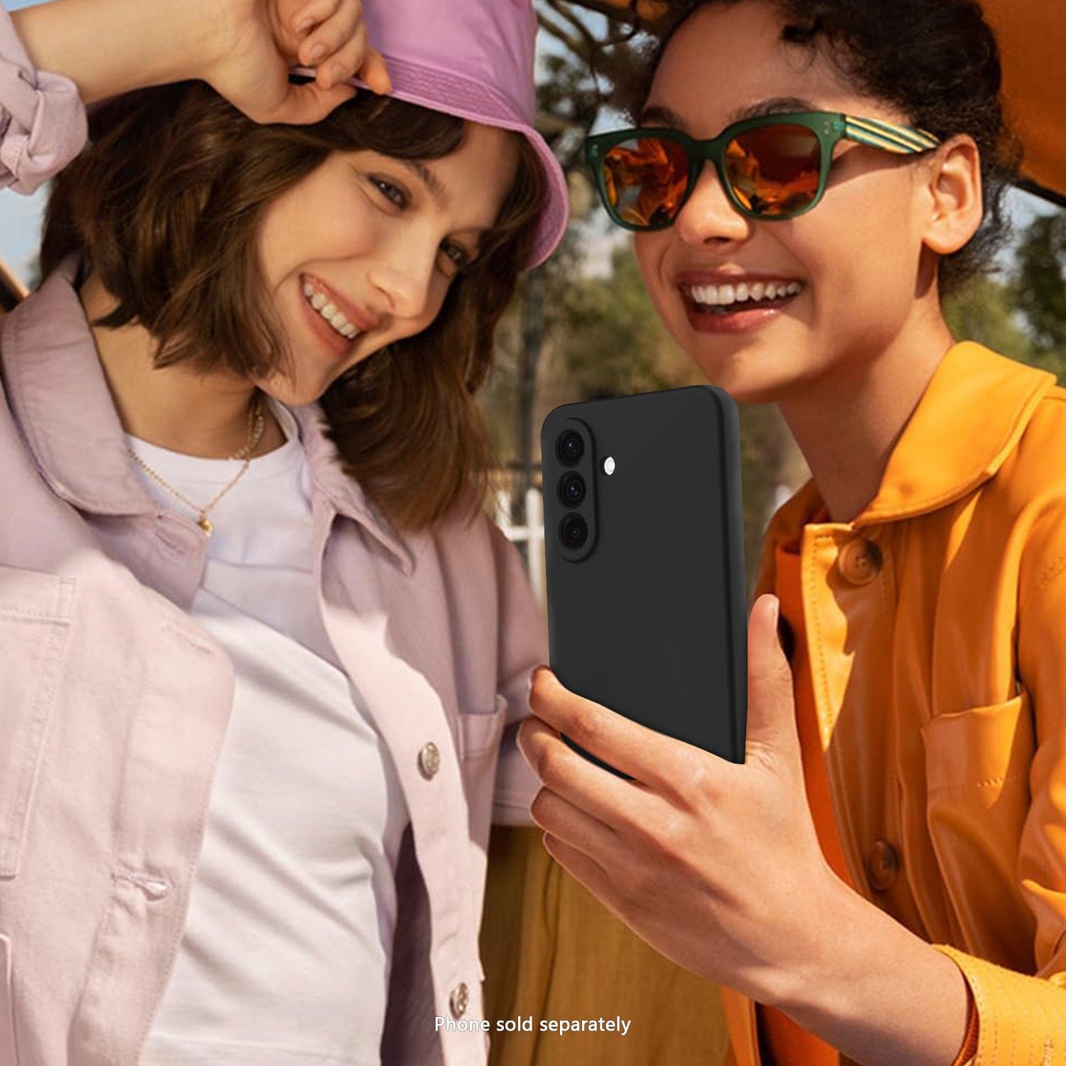 Two women looking at a Samsung Galaxy A57 case together outdoors.