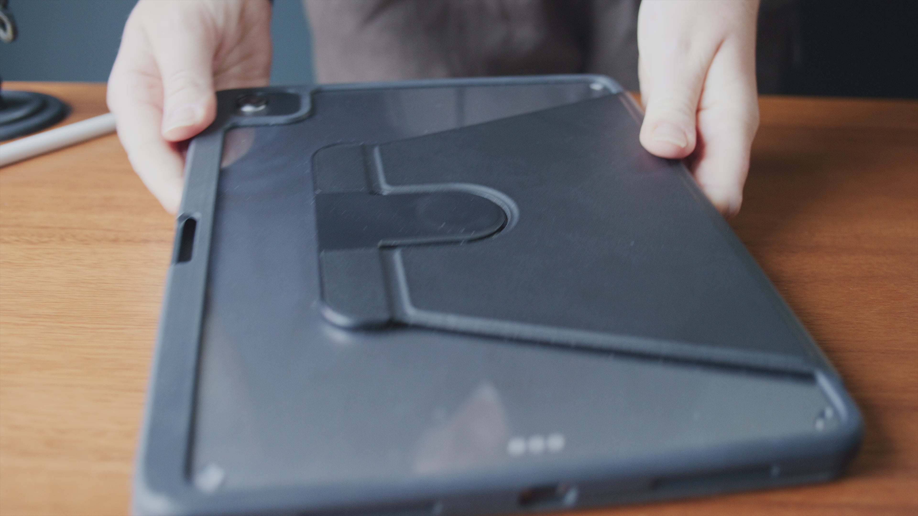 Lifestyle slim rugged smartphone case with black finish displayed in branding photo.